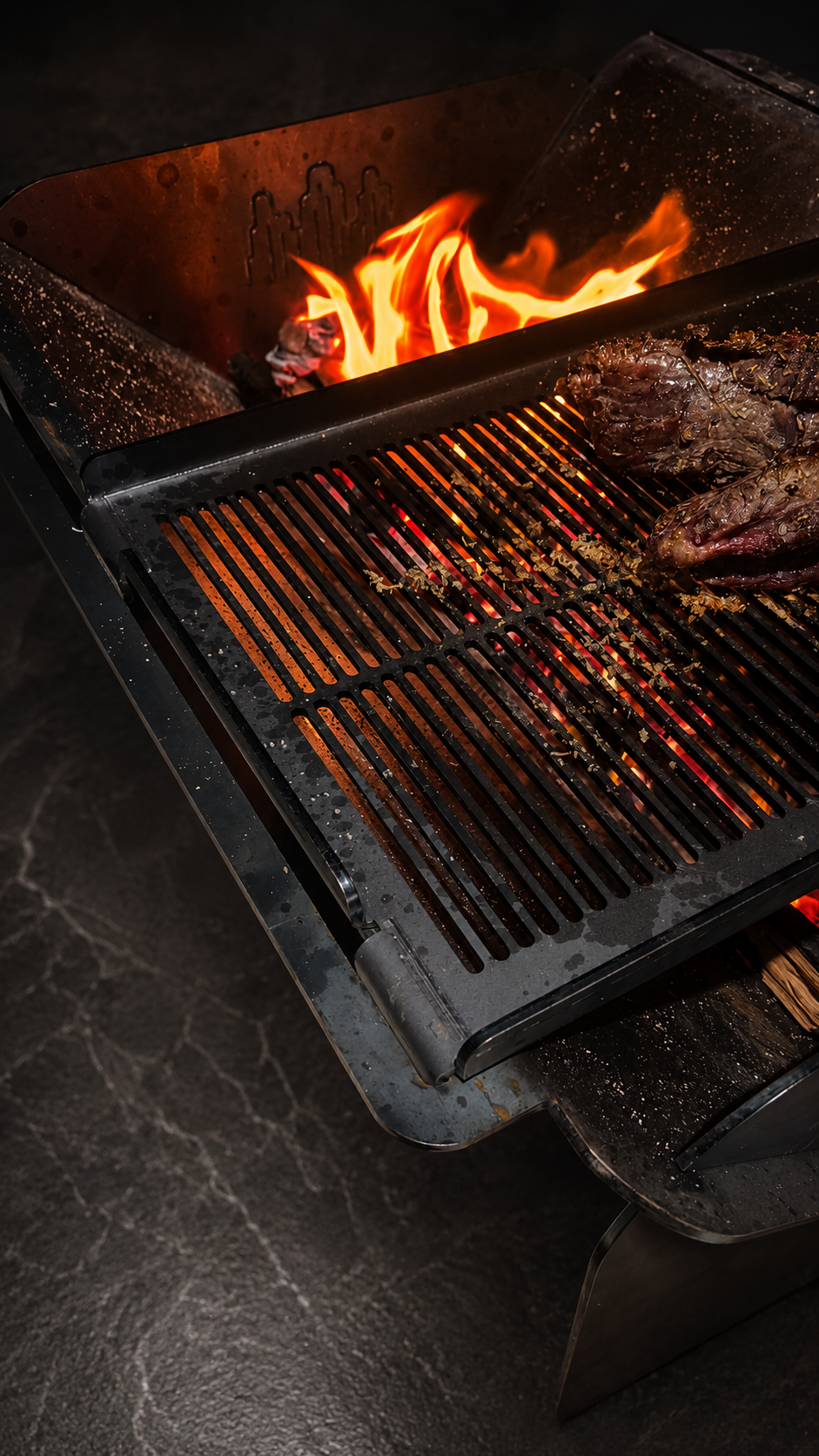 Close-up detail of the Wild Ember sliding cooking grill