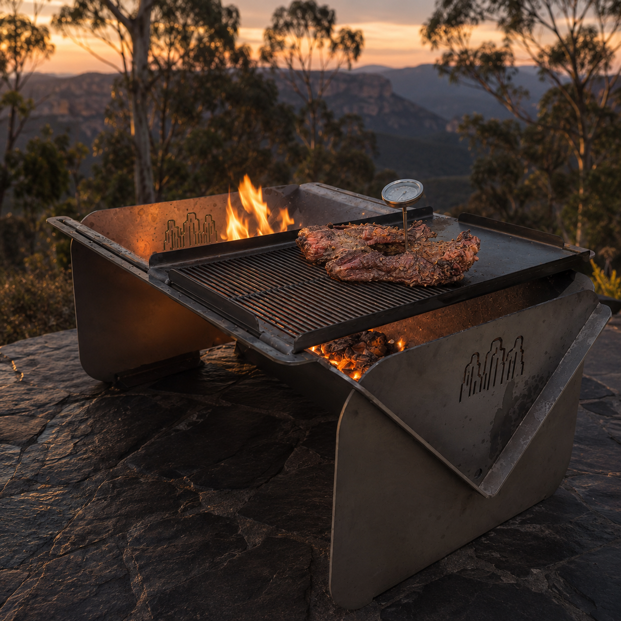 Wild Ember fire pit and grill overlooking the Blue Mountains at sunset